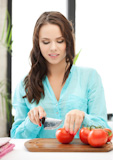 woman in the kitchen cutting vegetables