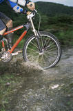 Man+outdoors+on+trails+riding+bicycle+%28selective+focus%29