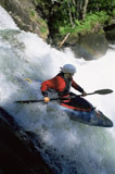 Kayaker+in+rapids+going+over+waterfall+%28blur%29
