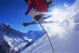 Skier+jumping+on+snowy+hill+%28lens+flare%29