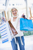 Woman+with+shopping+bags+at+a+shopping+mall
