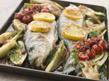 Whole+Sea+Bass+Roasted+with+Fennel+Lemon+Garlic+and+Cherry+Tomatoes+on+the+Vine