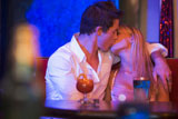 Young+couple+kissing+in+a+bar