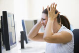 Woman+in+computer+room+looking+frustrated