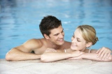 Young+Couple+Swimming+In+Pool