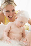 Mother+giving+baby+bubble+bath+smiling
