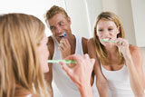 Couple+in+bathroom+brushing+teeth
