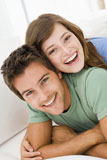 Couple+in+living+room+smiling
