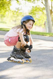 Young+girl+outdoors+on+inline+skates+smiling