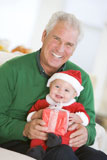 Grandfather+With+Baby+In+Santa+Outfit