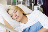 Woman+Lying+Down+In+Hospital+Bed
