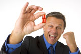 Businessman+Holding+Two+Red+Dice+