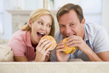 Couple+Enjoying+Burgers+Together
