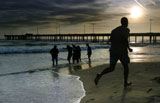 Man+joggs+on+the+beach