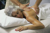 Close-up+of+a+senior+woman+getting+a+back+massage+from+a+massage+therapist