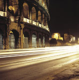 Traffic+in+front+of+a+coliseum%2C+Colosseum%2C+Rome%2C+Italy