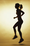 Silhouette+of+a+young+woman+exercising