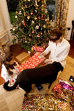 High+angle+view+of+a+teenage+girl+and+a+girl+wrapping+a+Christmas+present