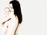 Rear+view+of+a+naked+young+woman+holding+her+baby