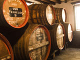 Wine+barrels+in+a+cellar