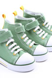 two+pairs+of+green+sneakers+for+children+close-ups