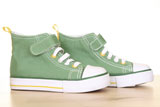green+sneakers+for+children+on+the+floor