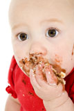 Baby+eating+cake%2C+making+mess+on+face.