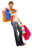 girl+smiling+and+carrying+shopping+bags+isolated+over+a+white+background