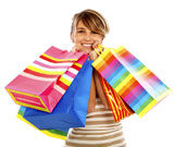 girl+smiling+and+carrying+shopping+bags+isolated+over+a+white+background