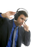 Businessman+hearing+and+singing+music+with+headphones%2C+take+a+break
