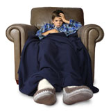 Sick+child+with+thermometer%2C+sitting+in+a+big+leather+chair+covered+with+blankets.+