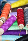 Sewing+threads+in+diverse+colors.+Clothing+and+fashion+concept+