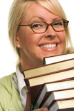 Attractive+Student+Carrying+Her+Books+Isolated+on+a+White+Background.