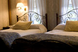 Two+queen+beds+in+classic+bedroom+