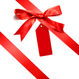Holiday+red+bow+islotaed+on+white+background+