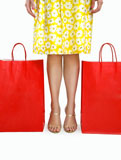 Mid+adult+Italian+woman+holding+standing+betweend+shopping+bags+