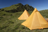 Two+yellow+tents+just+standing+on+grassland+in+Taiwan+National+Park.+