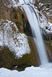 Waterfall+surrounded+with+snow+and+icicles+