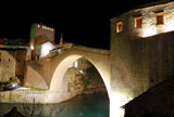 Old+Bridge+in+Mostar+at+night+reconstructed+in+2003+after+the+original+from+1556.+