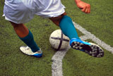 soccer+player+about+to+give+a+kick+to+the+ball+