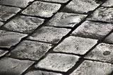 pavement+of+grey+old+cobblestones+shining+in+the+sunlight+