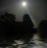 Full+Moon+shining+above+tree+silhouettes+and+water.+