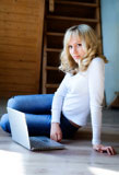 Fair-haired+girl+in+jeans+and+a+white+blouse+with+the+computer+