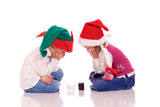 Cute+little+children+with+christmas+hats+waiting+for+Santa+