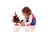 Cute+little+girl+with+a+christmas+tree+