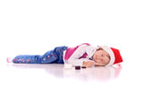 Cute+little+girl+with+a+christmas+hat+lying+on+the+floor+
