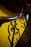 An+abstract+image+of+an+old+stairwell+and+railing+with+decorative+iron.+