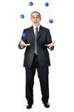 Business+man+in+suit+juggling+planet+earth+balls+