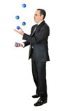 Business+man+in+suit+juggling+planet+earth+balls+