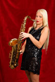 Young+blonde+woman+playing+saxophone+in+a+black+dress+